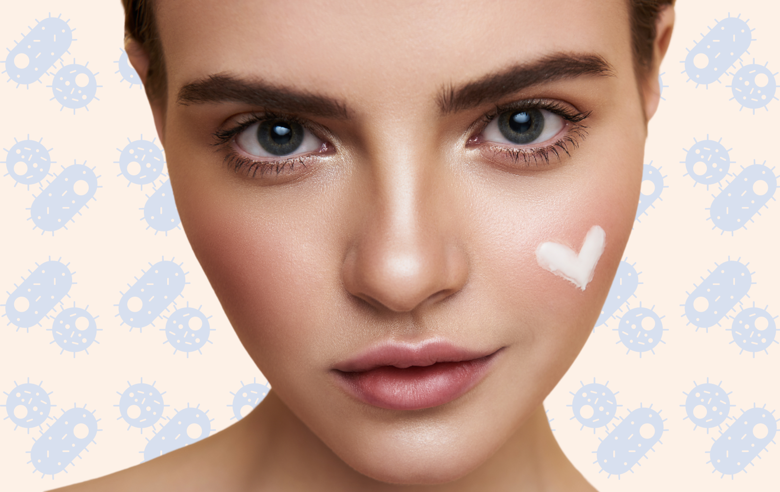 Woman with lotion shaped like heart on cheek with background of illustrated bacteria