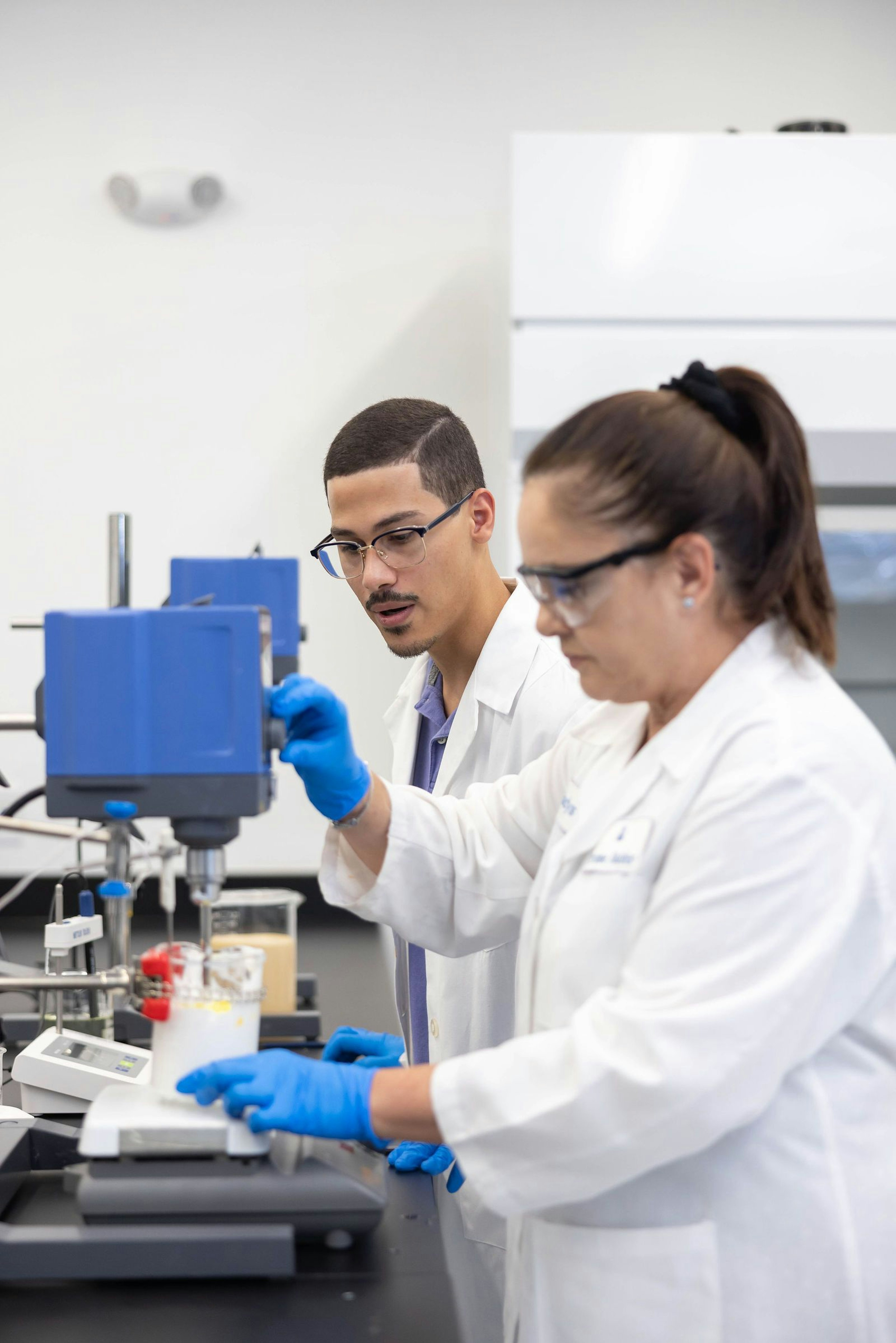 man and woman in lab developing products